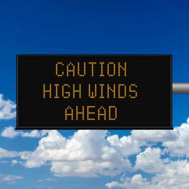 RV driving in crosswinds warning sign