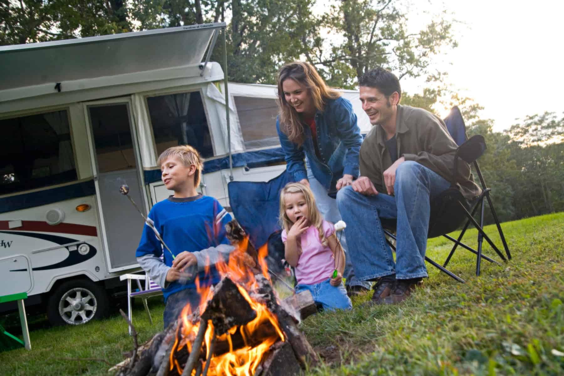 family in small pop-up RV trailer