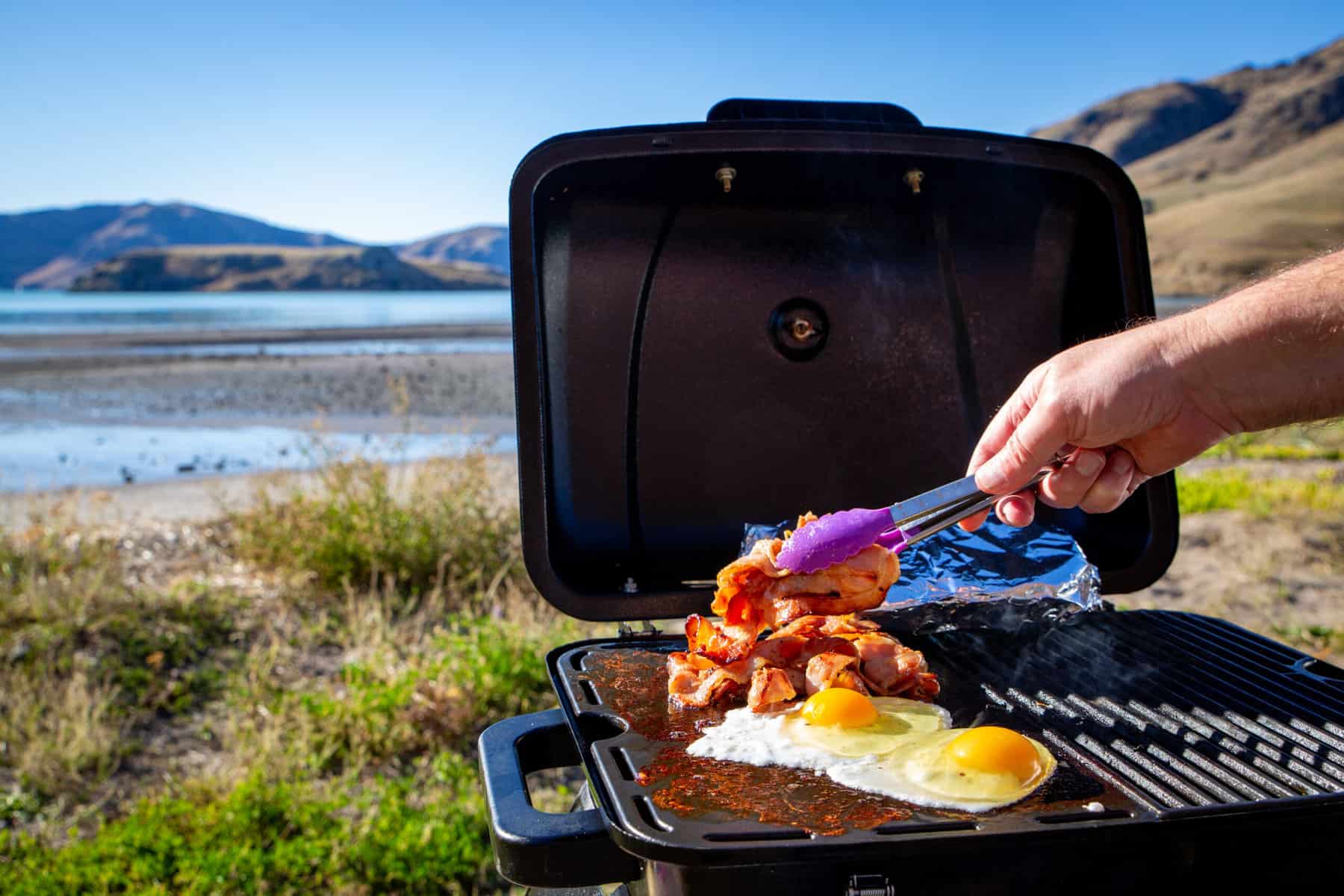 cooking bacon on the best RV grills 2022