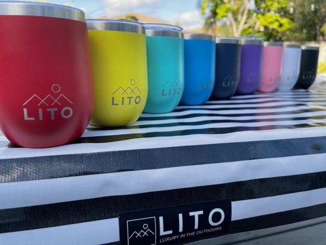 9 LITO Wine Tumblers arranged on a LITO tablecloth
