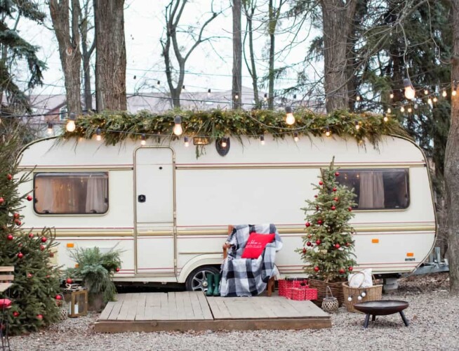 holiday christmas lights adorn a travel trailer