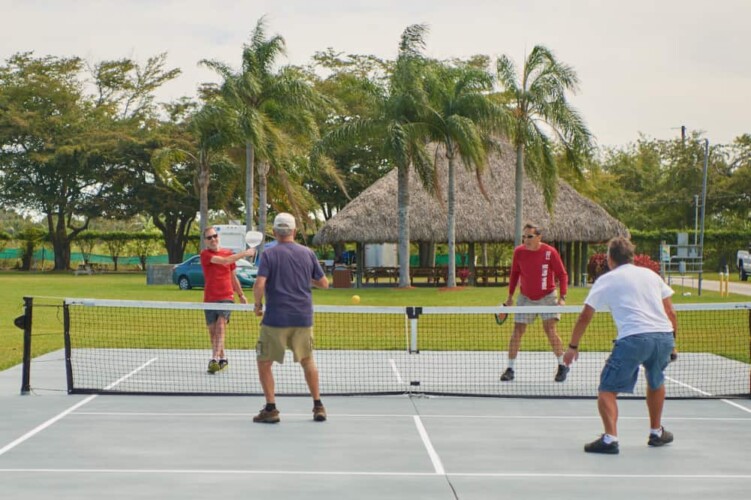 Pickleball players at Miami Everglades RV Resort, open in Florida for snowbirds