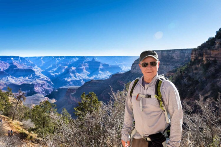mature man sightseeing at the Grand Canyon. (Image: Shutterstock)