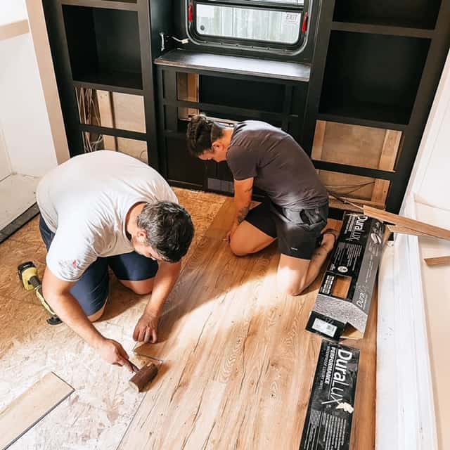 The Penningtons installing new fifth wheel flooring. (Image: Kayla Pennington)