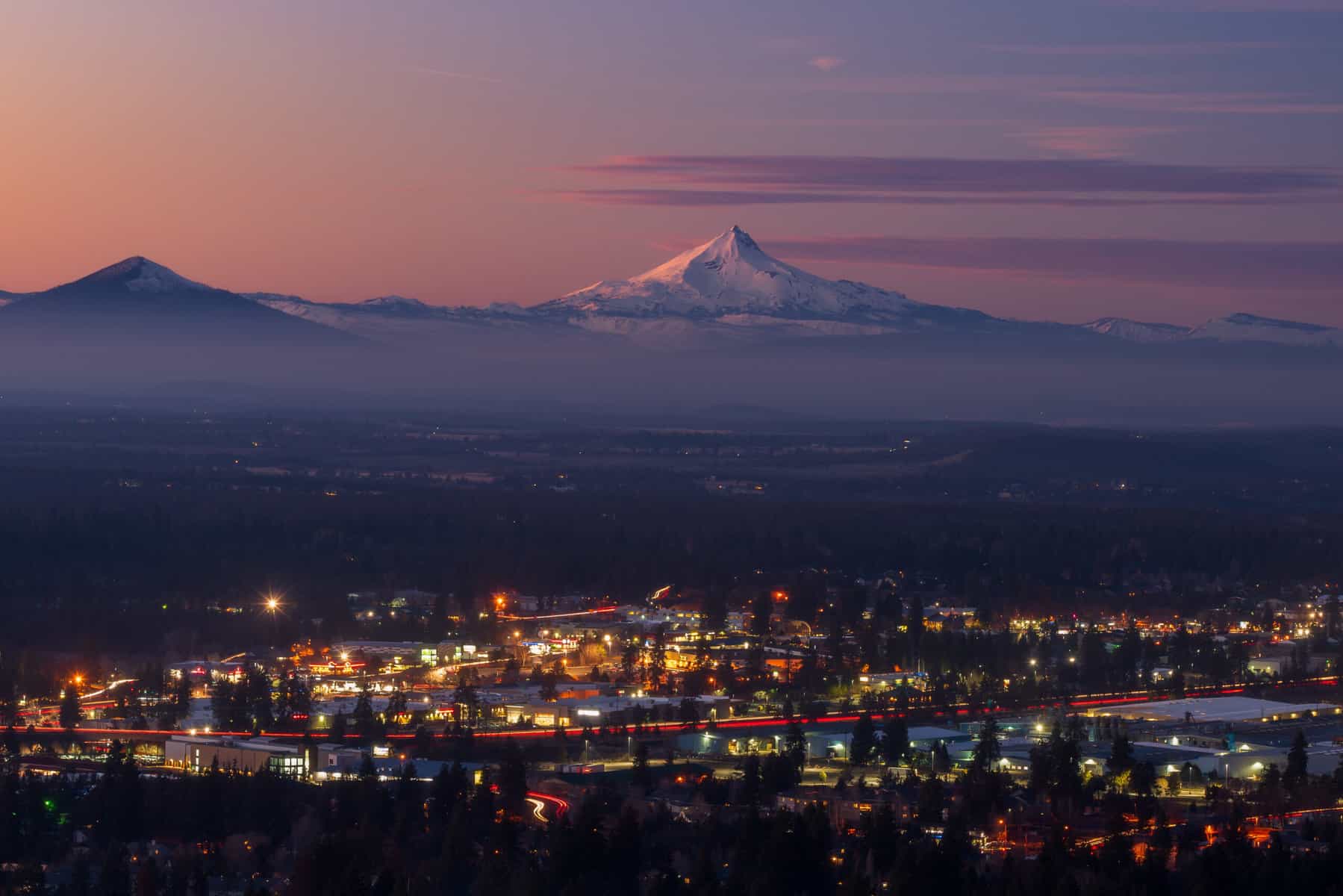 Mount Hood in the distance of Bend city lights (Image: Shutterstock)
