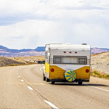 Retro camper trailer on the road (Image: Shutterstock)