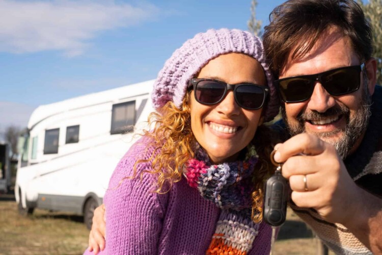 RV buying scam artist couple in front of motorhome for sale