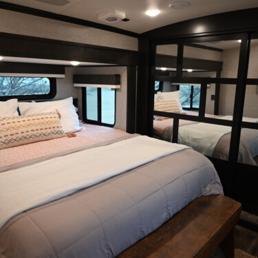 better sleep in RV bedroom with cozy bedding and shades
