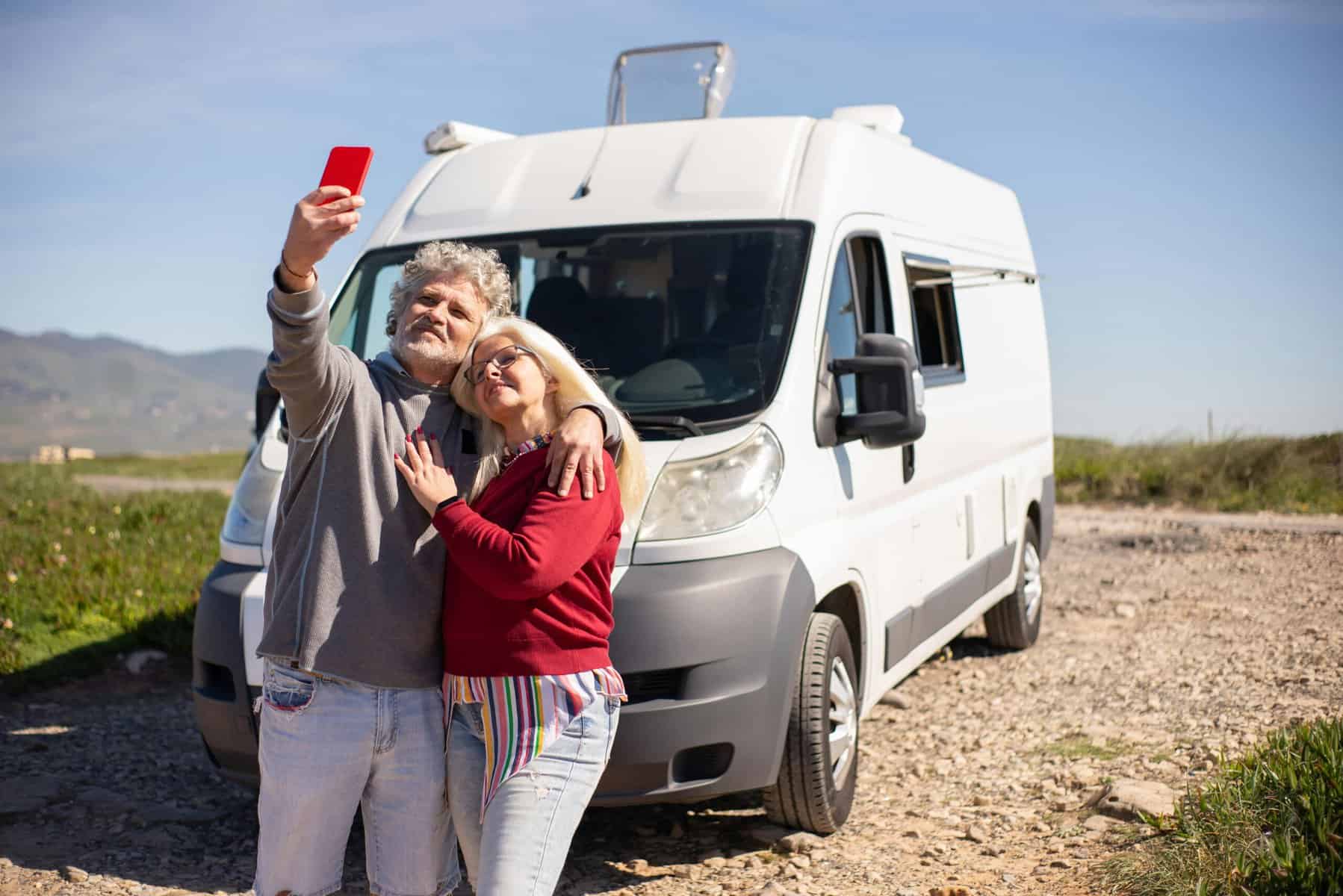 Senior couple with campervan taking selfie (Image: Krampus Productions, Pexels.com)