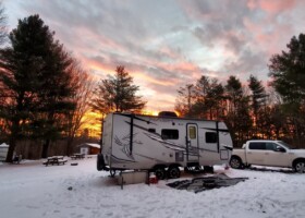 Nash trailer camping in snow at sunset (Image: @Zanzabar, iRV2 Forums member)