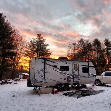 Nash trailer camping in snow at sunset (Image: @Zanzabar, iRV2 Forums member)