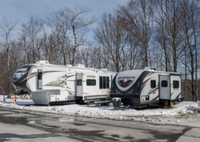fifth wheel and trailer camping in winter snow