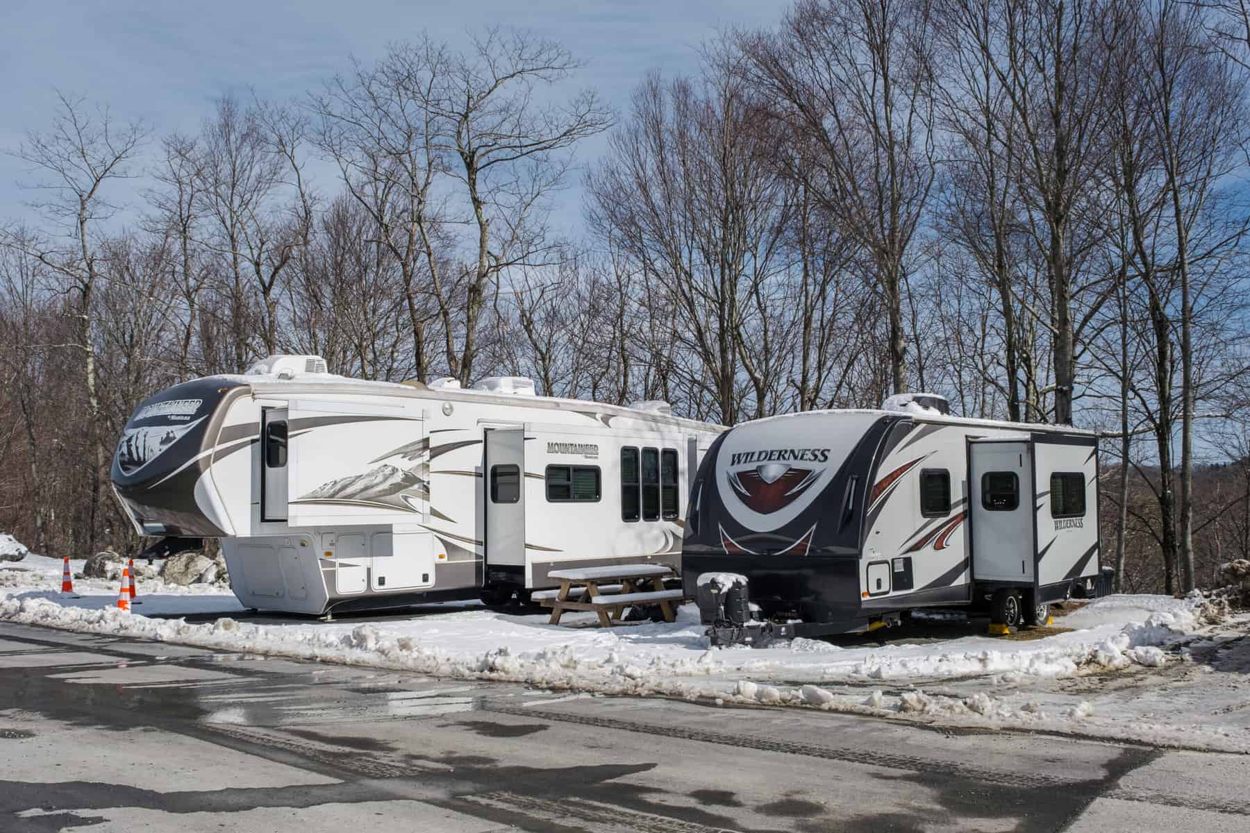 fifth wheel and trailer camping in winter snow
